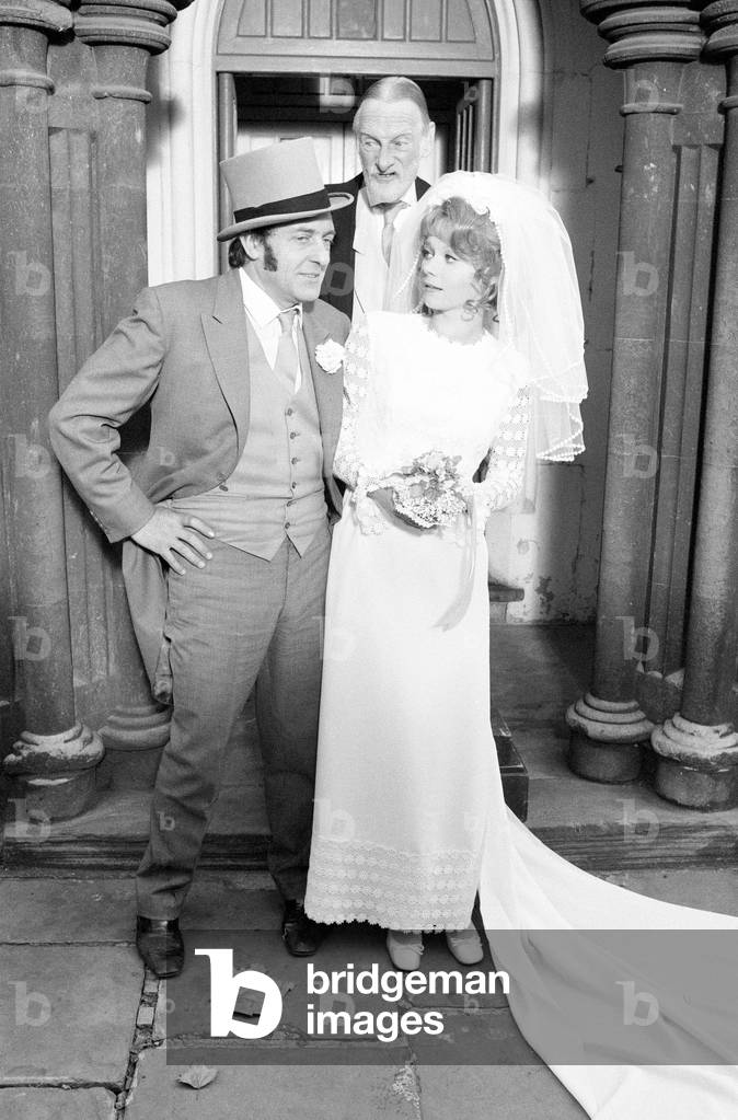 Steptoe and Son, film released 1972, starring Wildred Brambell as Albert Steptoe, Harry H Corbett as his son Harold Steptoe, and Carolyn Seymour as wife Zita, pictured on location at St John's Church, Ladbroke Grove, London, Thursday 28th October 1971 (b/w photo)