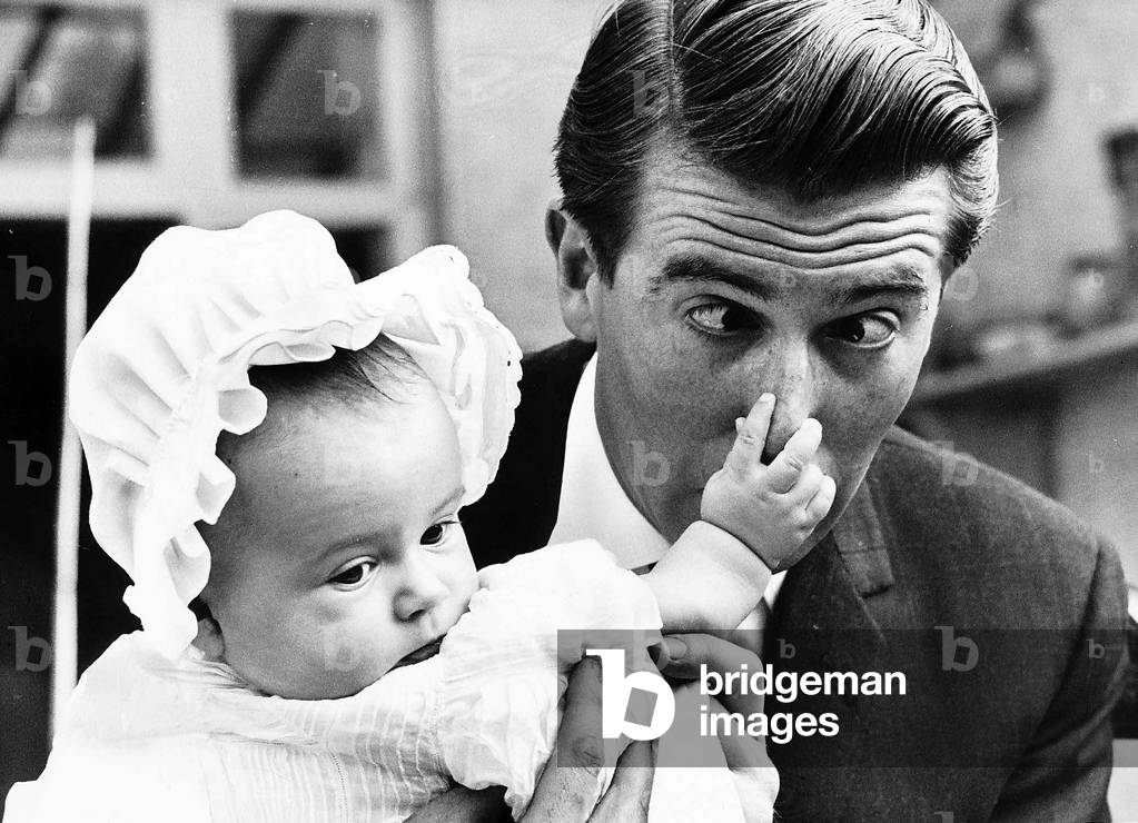 Actor and TV presenter Leslie Crowther and his 4th baby daughter, 26th May 1963 (b/w photo)
