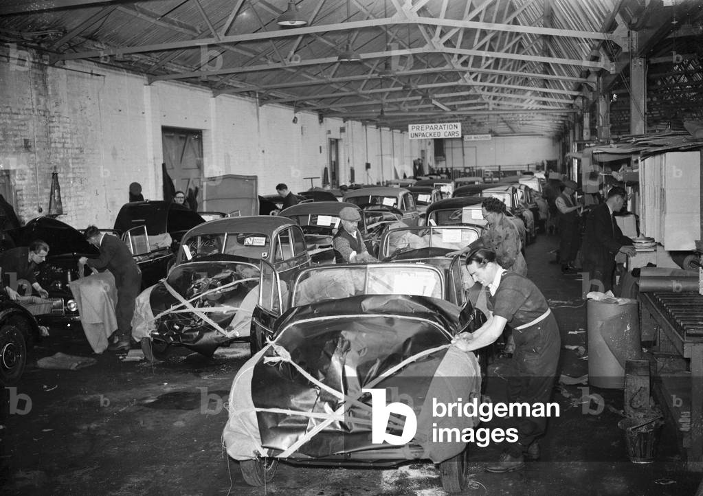 Morris Minor Low Light Sedans fresh of the production line being packed for export at Morris's Cowley factory 24th March 1949 (b/w photo)