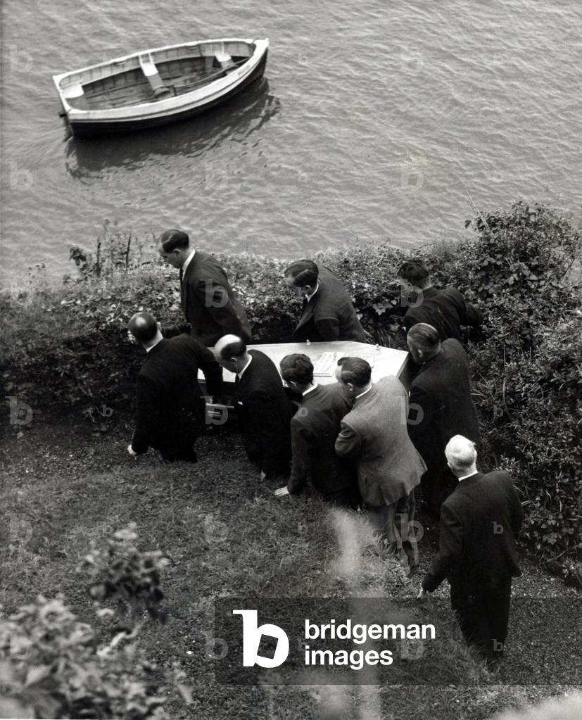 Dylan Thomas - Funeral - Pallbearers carry the coffin from the boathouse in Laugharne - 24th November 1953 (b/w photo)