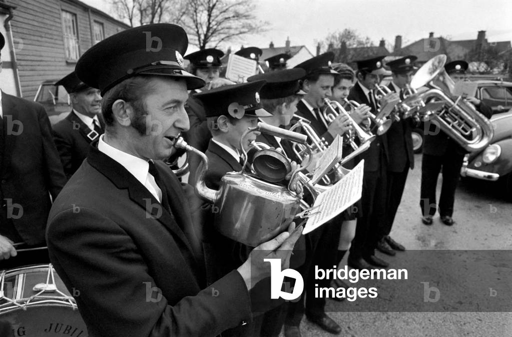 Man playing the kettle for the Pilling Jubilee Silver Band. November 1969
