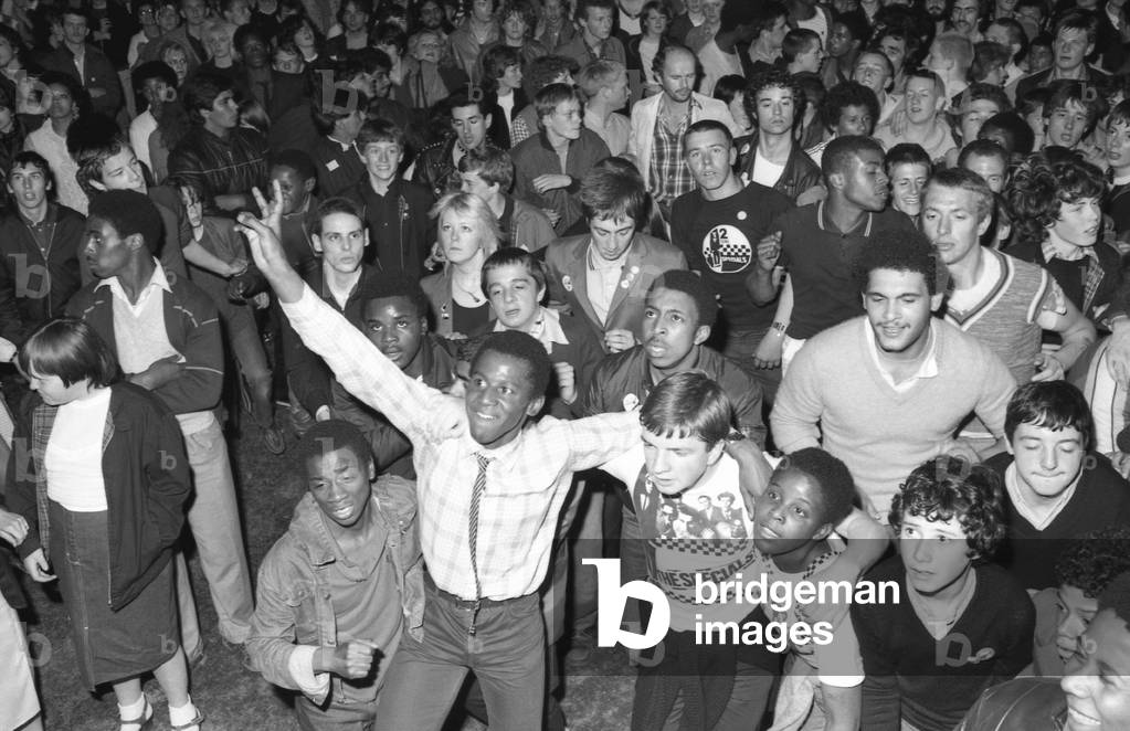 Hazel O'Connor and The Specials performed on stage at the outdoor concert in aid of racial harmony at The Butts stadium in Coventry, 22nd June 1981 (b/w photo)