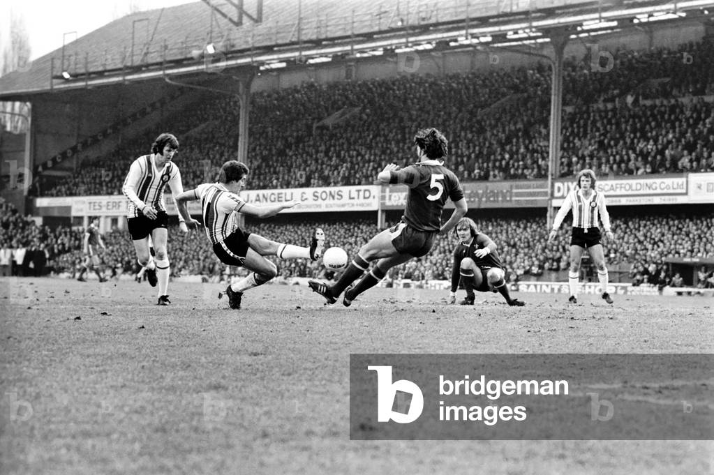F. A. Cup. Southampton (1) vs. Chelsea (1). Ted MacDougal (Southampton) has his shot blocked by Micky Droy (Chelsea). January 1977 (photo)
