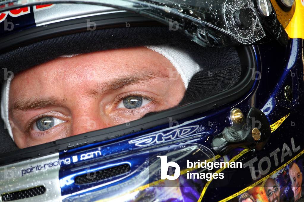 Red Bull Racing driver Sebastian Vettel in the garage, Formula 1 Santander British Grand Prix, Friday practice, Silverstone, Towcester, Northamptonshire, UK, 8th July 2011 (photo)