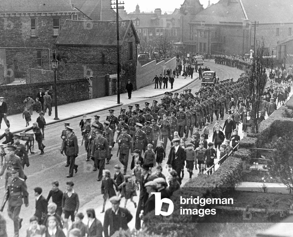 The march of 700 Territorial troops in a recruiting drive, last night, was the biggest military parade in Gateshead for many years. Here is an impression as the column moved along Dryden Road. 10th May 1939.