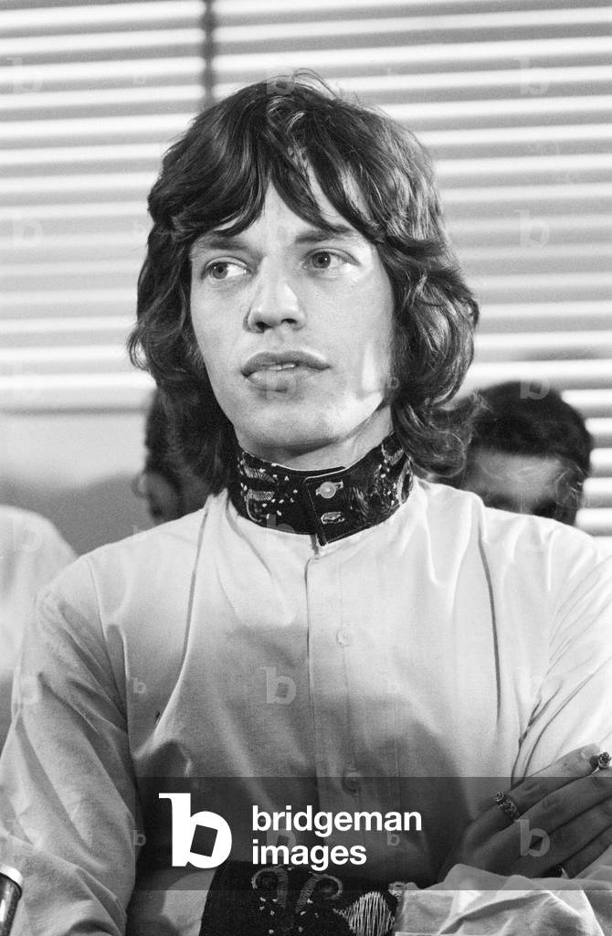 Appeal hearing at the Appeal Court in Central London where Rolling Stones lead singer Mick Jagger and Keith Richards had their convictions and sentence for drug charges set aside by Lord Parker the Lord Chief Justice, Lord Justice Winn and Mr Justice Cusack. Picture shows Mick Jagger holding a press conference in Soho after the hearing where he was given a conditional discharge and talking to in place of his three month prison sentence. 31st July 1967 (b/w photo)