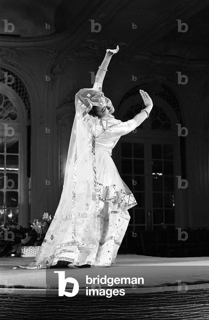 Fashion show featuring Pakistani designs, modelled by young model recently arrived from Pakistan, April 1962.