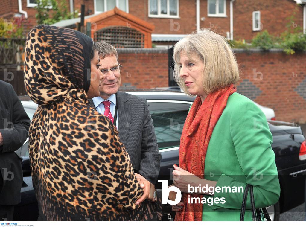 The Home secretary, the Rt Hon Theresa May visited the Kanzul Iman central Jamia mosque in Tipton, West Midlands today after a bomb was found outside it she is pictured with Masarrat Saleem, youngest daughter of the murdered Mohammed Saleem; 17/9/2013 (photo)