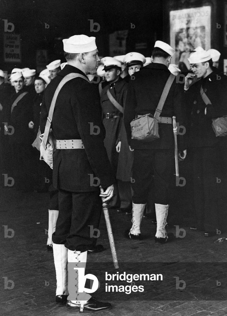 American Naval policeman photographed at Kings Cross station in London, 26th July 1942 (b/w photo)