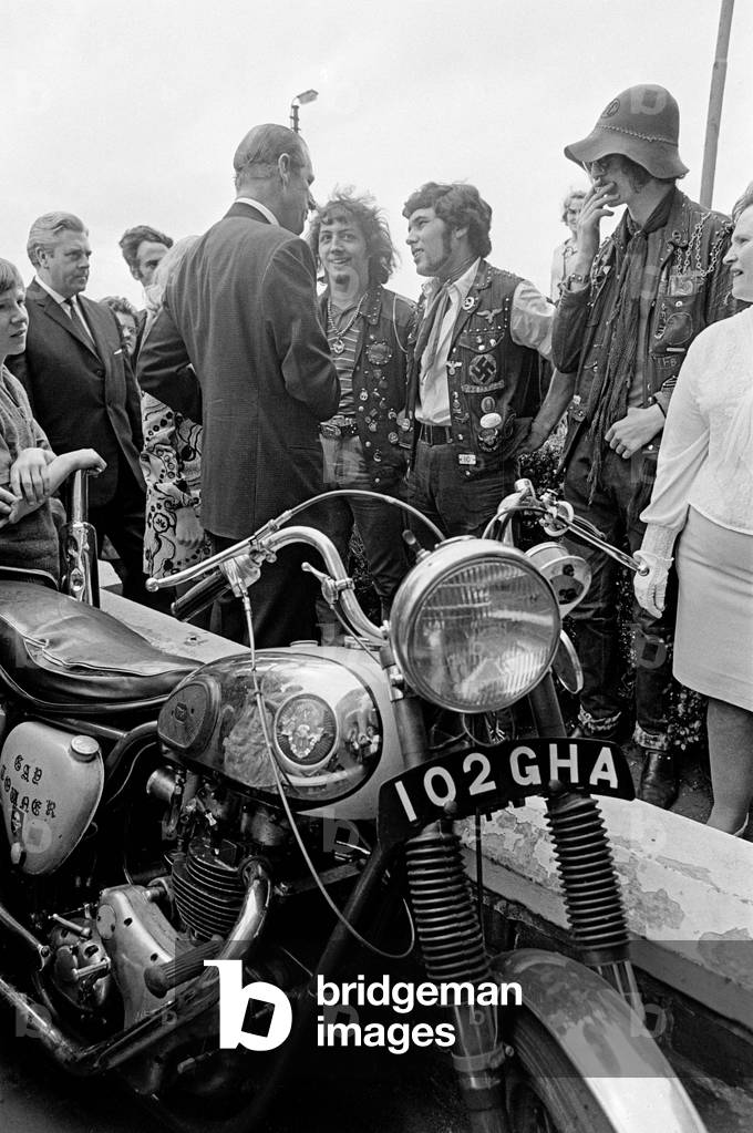 Prince Philip talking to three members of the Devil's Club at the Young volunteers Force Foundation at Low Hill. 22nd June 1970 (b/w photo)