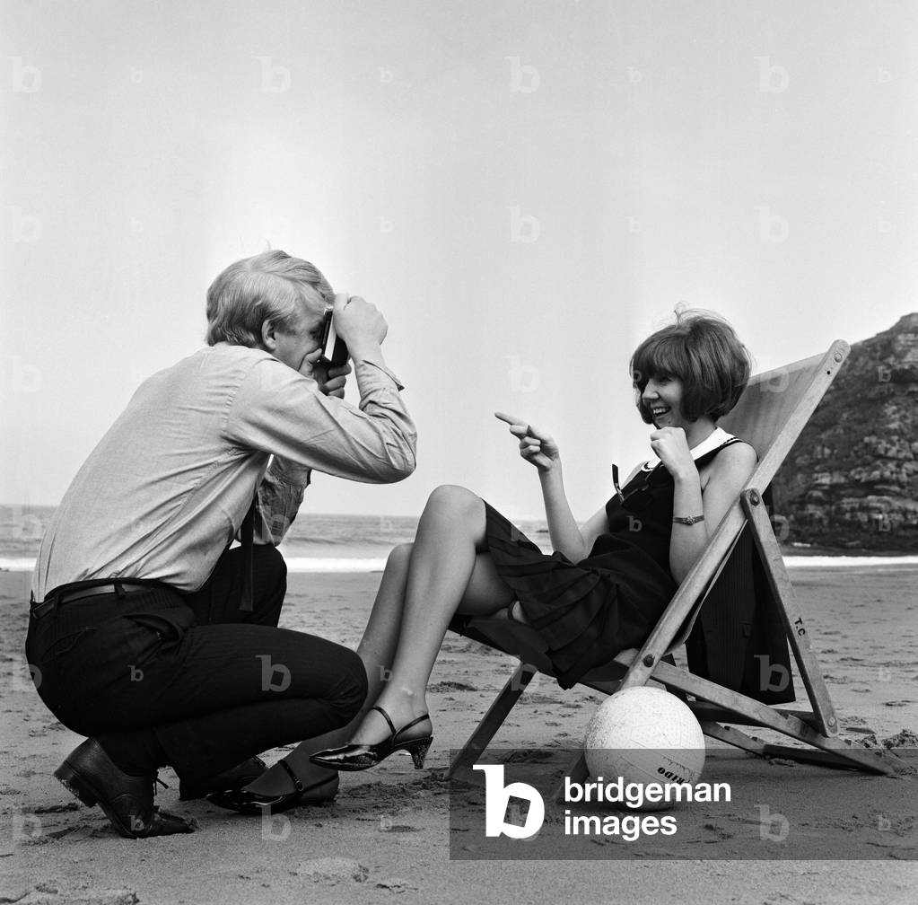 Cilla Black and her manager Bobby Willis on a beach on the Northumbrian coast. 8th June 1965.