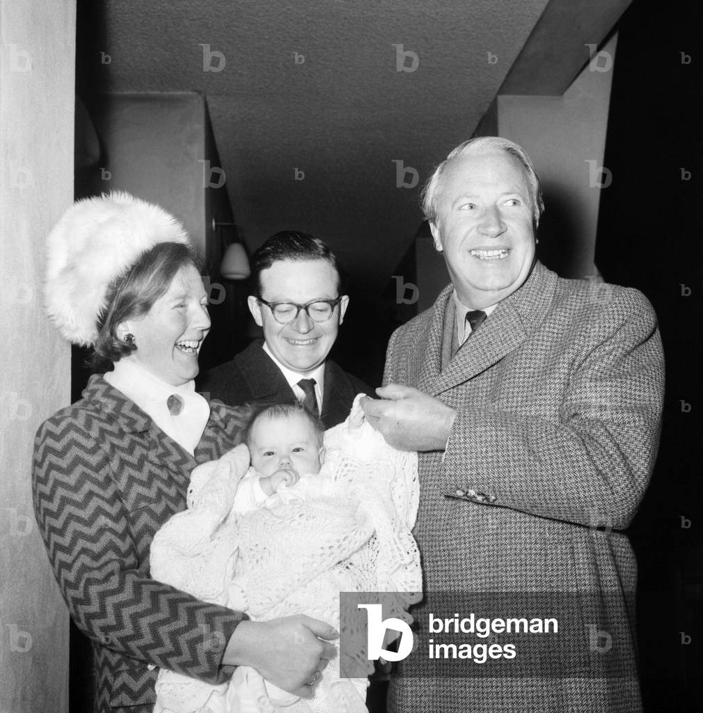 Politics: Edward Heath, leader of the Conservative Party, was godfather for the fourteenth time . It was the turn of five-month old Catriona, 3rd child of his ex-secretary Mrs. Jean MacGregor of Hornsey. December 1969
