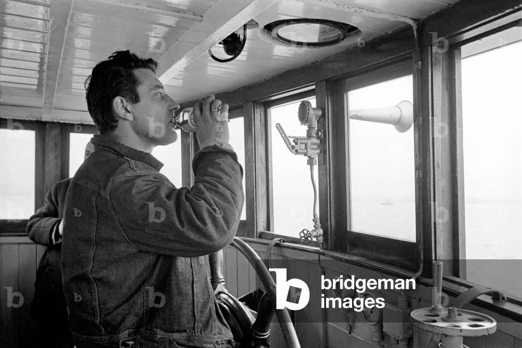 Radio London: Pirate Radio Station. General scene around the Motor Vessel Galaxy which is home to Radio London. Whilst the disc jockeys broadcast to the nation, the skipper ensures that they keep 12 miles off shore, the chef prepares a meal and the technicians ensure that equipment is working, 1965 (b/w photo)