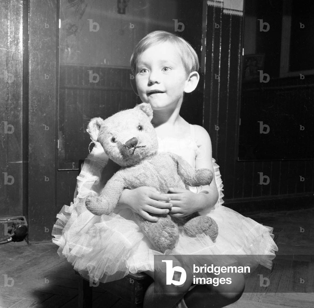 3 year old Susan Moroney at the Slocombe School of Ballet, Cardiff, who her Teddy Bear to classes to help her settle down.
10th July 1960