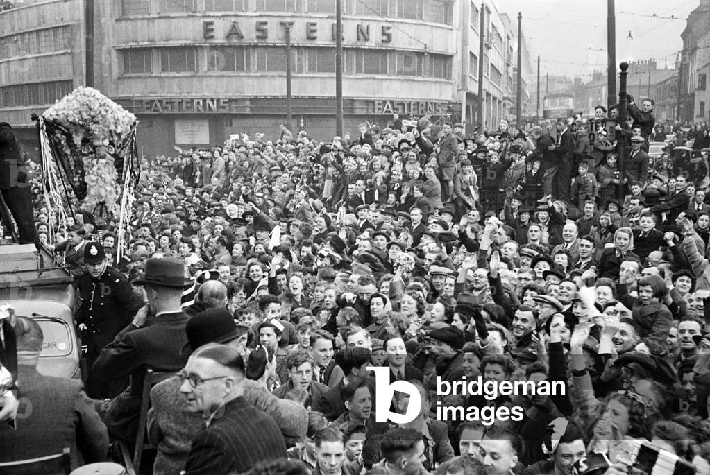 The Derby County team return home with the FA Cup trophy following their victory over Charlton Athletic in the Final at Wembley. Picture shows: Part of the huge crowd cheering their heroes in the streets of Derby. 1st May 1946 (photo)