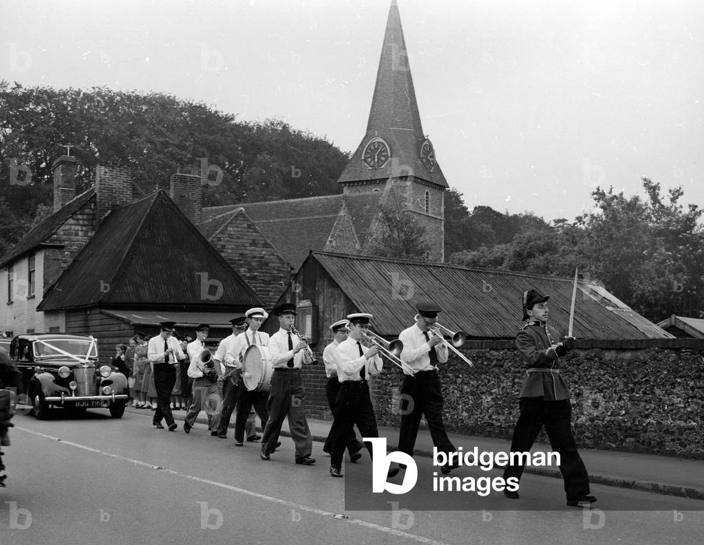 Wedding of William Albert Cooper and Maureen Ovenden at St. Peters church in the village of Bridge, Kent. Bridge Parish Church. They are both members of the Canterbury jazz club and jazz men from the club led the couple out of church playing 