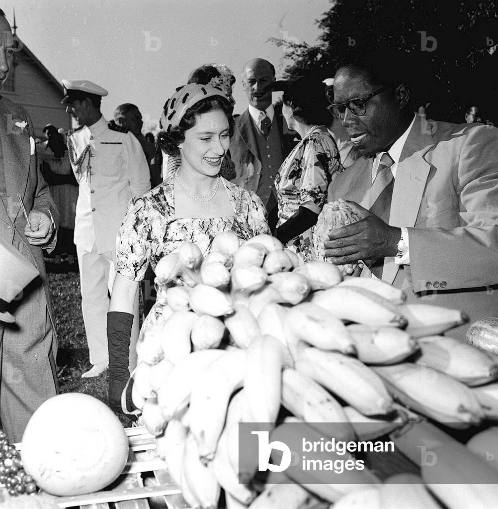 Princess Margaret is shown local produce as she tours Trinidad on a Royal Visit, August 1955 (b/w photo)
