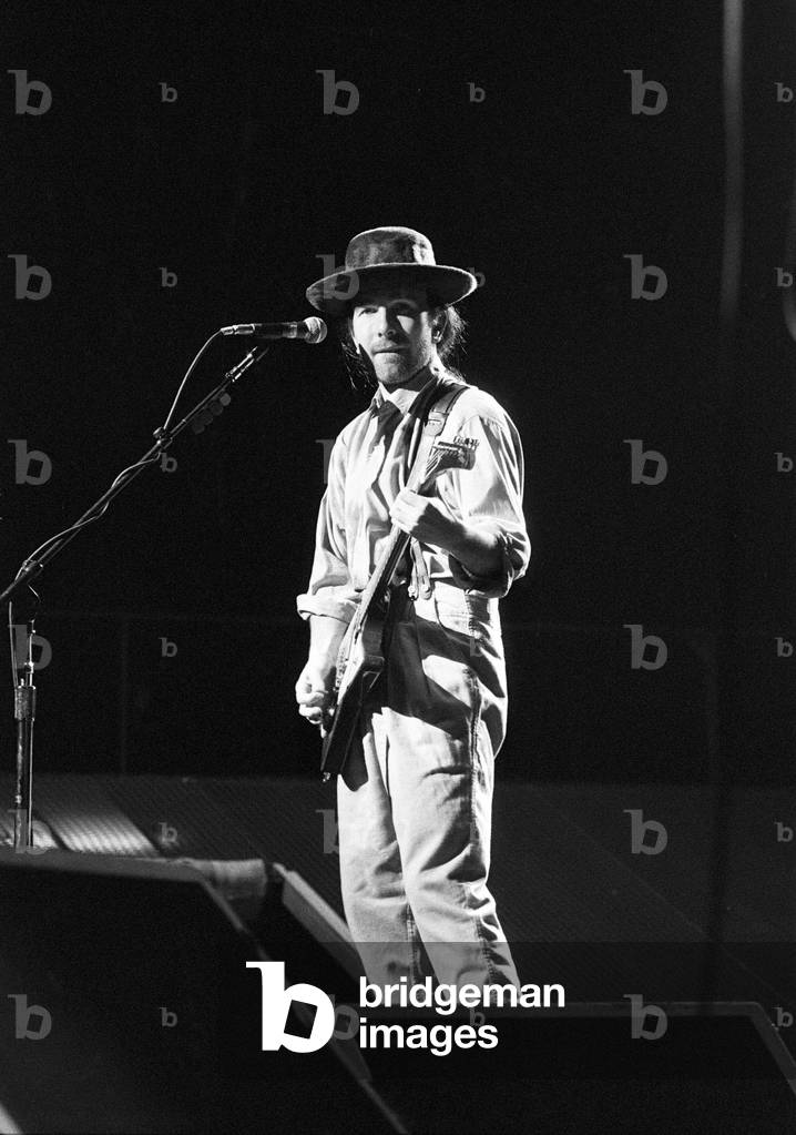 Rock group U2 performing on stage at the National Exhibition Centre in Birmingham. Pictured is lead guitarist The Edge. 3rd August 1987 (b/w photo)
