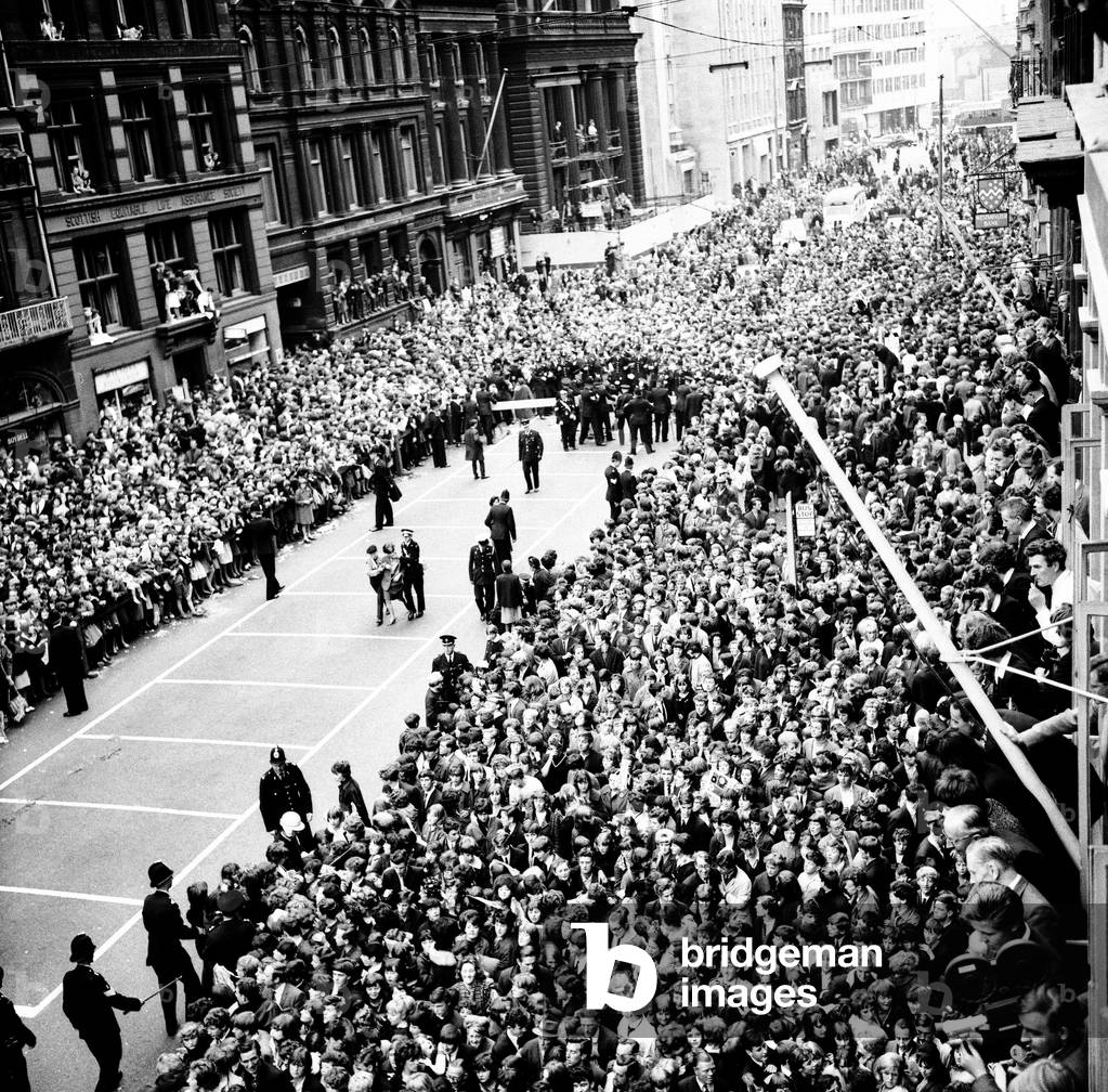 Police try to control fans in the streets of Liverpool before the premiere of The Beatles film 