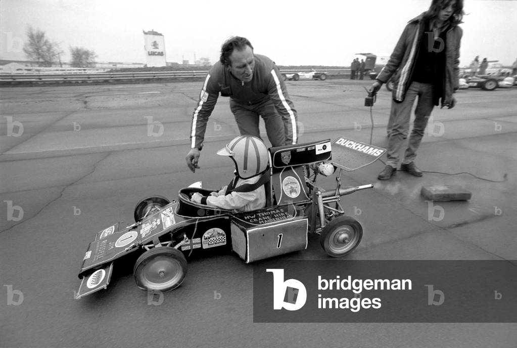 Angela four year old daughter of Ken James seen here at the wheel of her miniature petrol driven racing car, February 1975