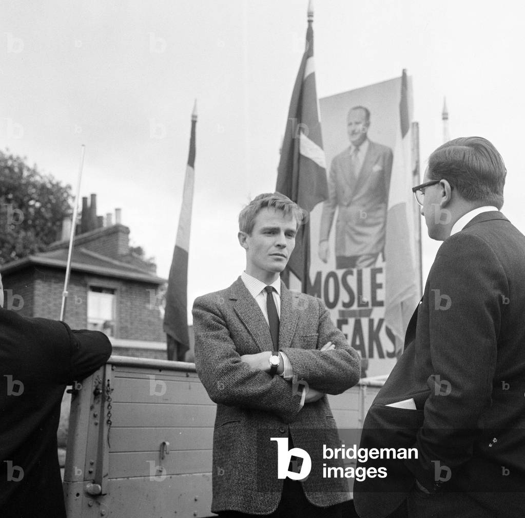 Max Mosley, son of Sir Oswald Mosley, attends one of his father's meetings at Dalston, 18th September 1962 (b/w photo)