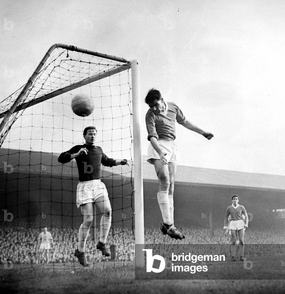 Manchester United versus Manchester City-keeper Greg was lucky to keep his goal intact in the first half -Carolan heads wide with Gregg behind. January 1960 (photo)