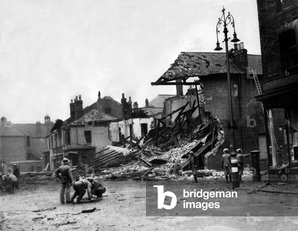 Second World War - The ruins after a German air raid on a North East of England town. ARP service attempt to make damaged property safe after the attack. 20th June, 1940 (b/w photo)
