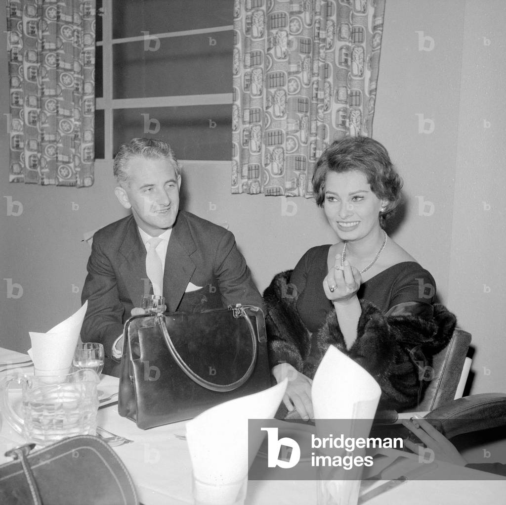 Actress Sophie Loren seen here standing before the presentation of a life size cake of herself
Circa 1962