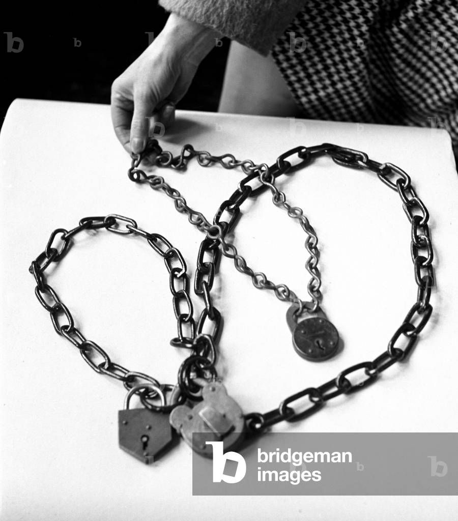 Militant equipment used by women Suffragettes during their campaign for the right to vote. Seen in a museum in South Kensington, London. Pictured are chains and padlocks used by Suffragettes to chain themselves to the Downing Street rails. 19th February 1947 (b/w photo)
