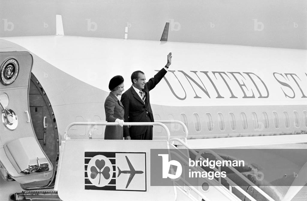 American President Richard Nixon waves to the crowds from Air Force One with his wife Pat as they arrive at Shannon Airport for a three day tour of the Republic of Ireland. 3rd October 1970 (b/w photo)