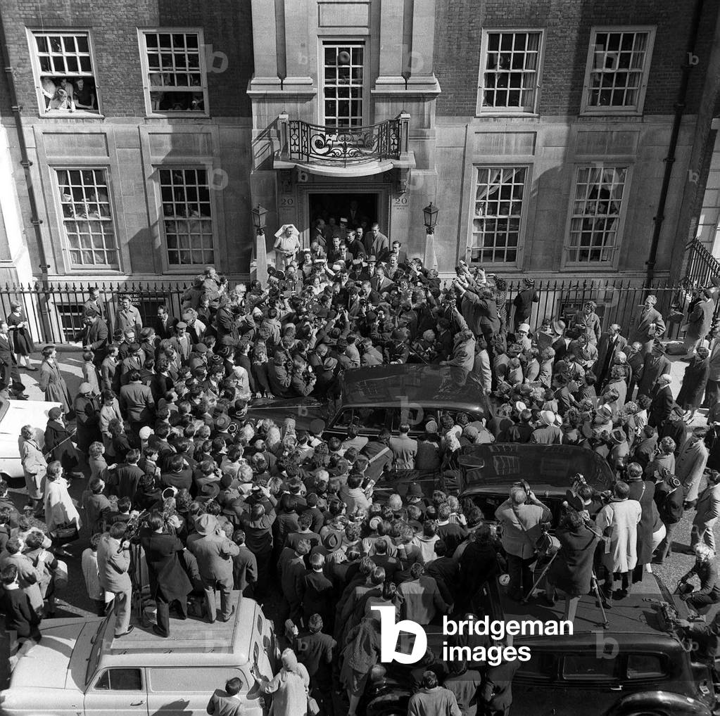 Elizabeth Taylor with Husband Eddie Fisher leaving London Clinic, March 1961 (b/w photo)