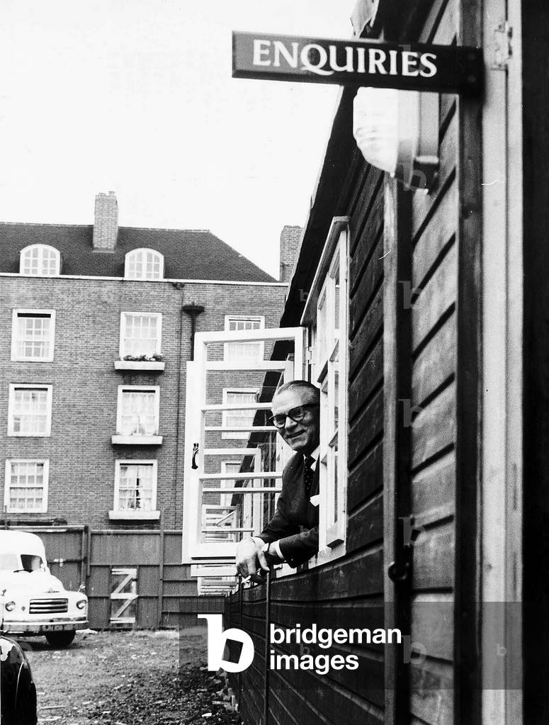 Sir Laurence Olivier actor at window of National Theatre offices in Duchy Street London, 1963