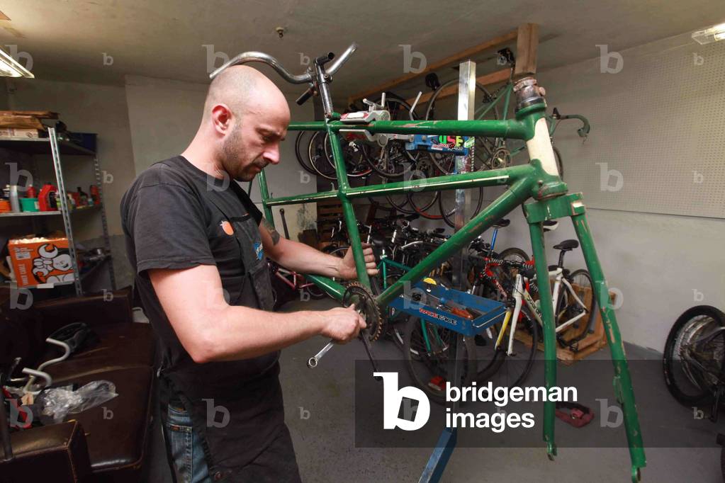 It has seen better days, but a record-breaking tandem from the 1930s is set to be restored to its former glory. The bicycle still holds the time trial record for a tandem ride from Berwick to Newcastle - and back. On May 5, 1935, Hugo Lloyd Caris, of Hexham, and his fellow rider - known only as R Johnson - took 5hrs 52mins to make the journey. In the years that followed, the tandem was used by Hugo - known to family and friends as Lloyd - and his family before it was packed away into a garage and forgotten about. Pictured is restorer John Swan of Bykology, 17/07/2014 (photo)