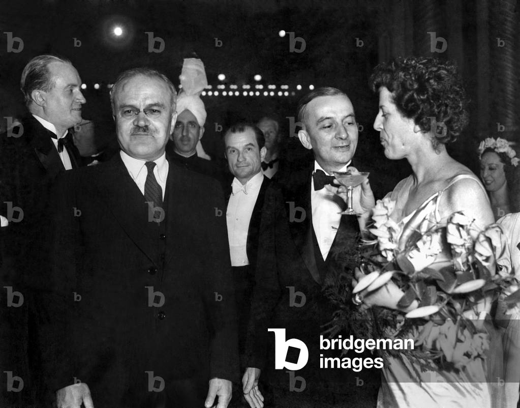 Soviet foreign minister Vyacheslav Mikhailovich Molotov, with Georges Bidault and Mme. Bidault in the foyer. 
August 1946
