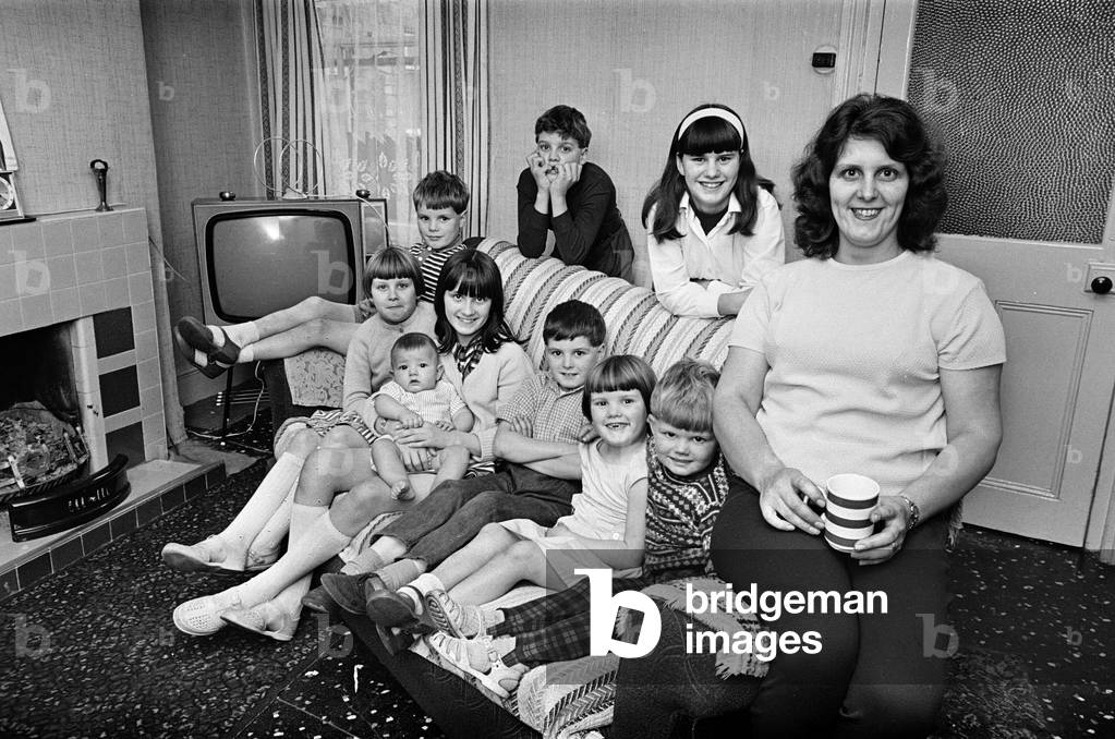 Pamela Spence and family, recently moved home to Arthur Street, Small Heath, Birmingham, 7th October 1969 (b/w photo)