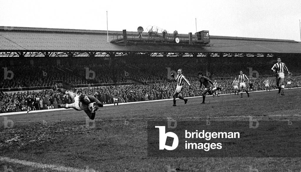 Sunderland goalkeeper Jim Montgomery dives spectacularly to make a fine save from Manchester United's George Best during their league match at Roker ParkNovember 1968 (photo)