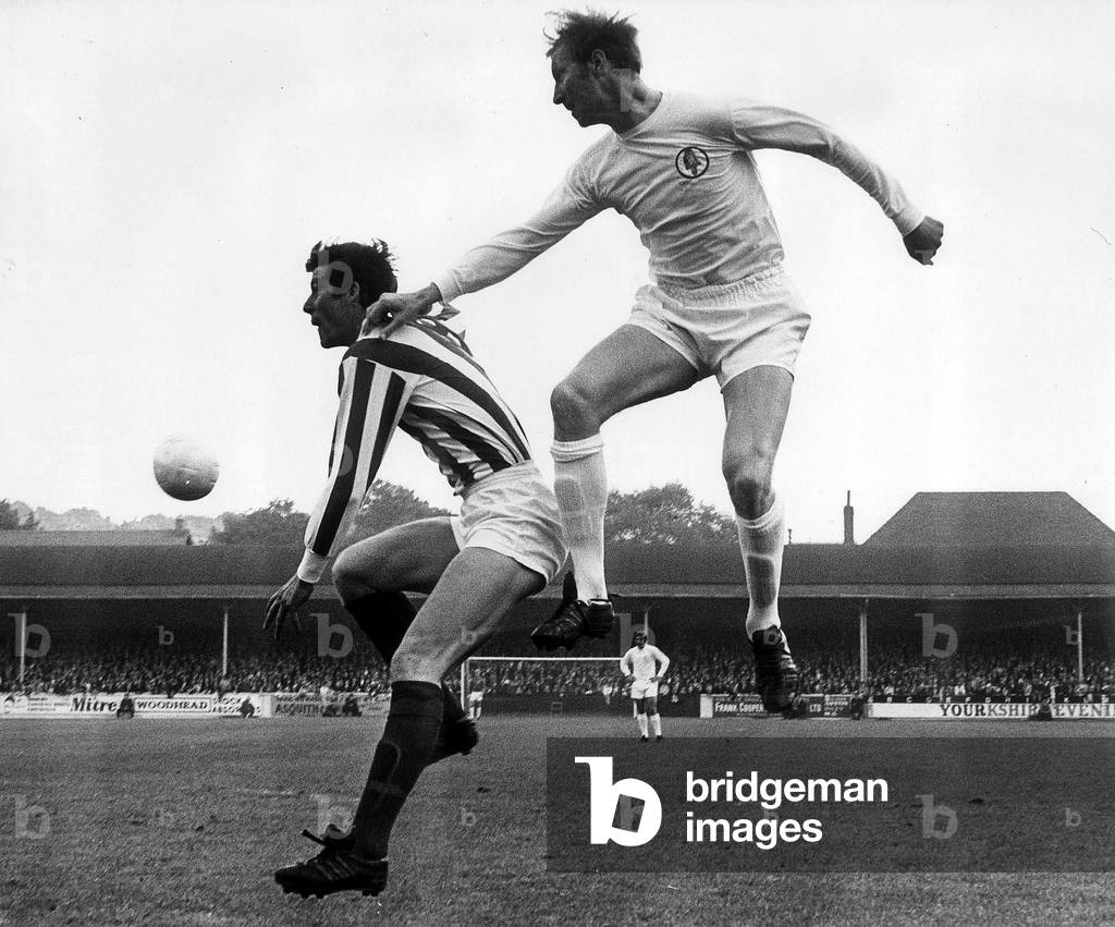 Jack Charlton of Leeds United jumps up to beat John Ritchie during their league match against Stoke City October 1969 (photo)