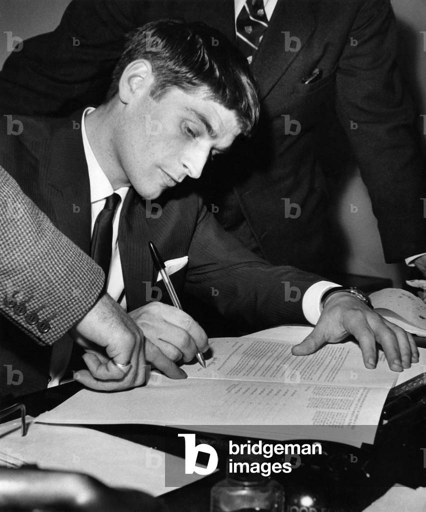 Close up as Johnnie Crossan signs today at Maine Rd, for M/cr. City, for a fee of approx £40,000. January 1965 (photo)
