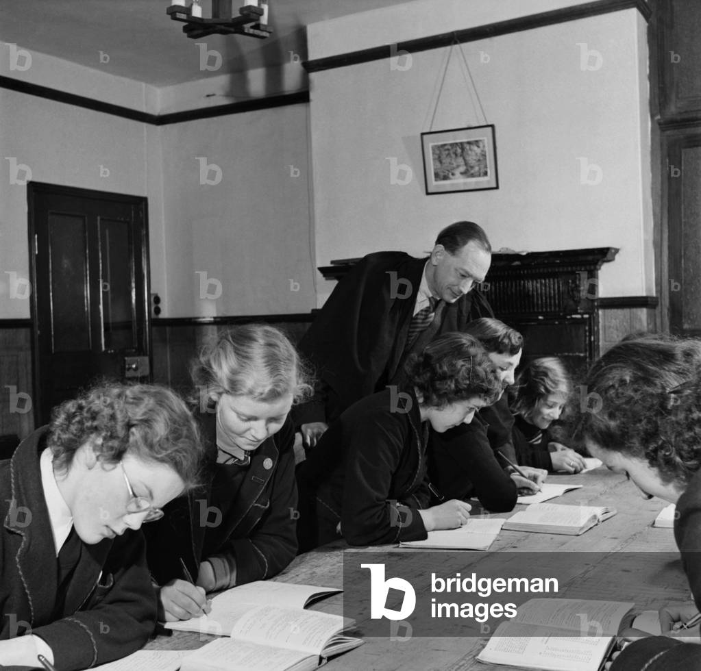 Mr. Charles L. Hall the headmaster of Westholme School with some of his pupils at the school. November 1952 C5790-001