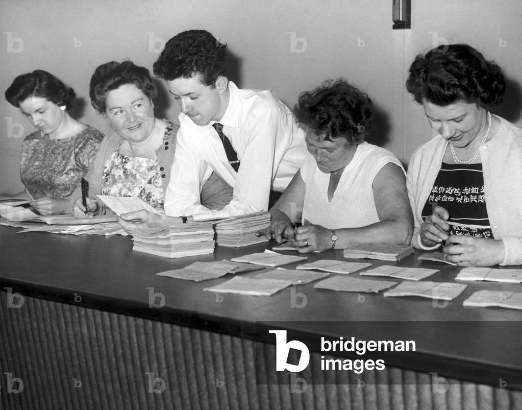 Australian cricket tour of England for the Ashes. England v Australia First Test match at Edgbaston. L-R: Ann Kerr, Mary Williams, Tony Haycock, Mrs Norah Deakins and Pat Craig at work on the ticket rush for the test. 6th June 1961 (b/w photo)