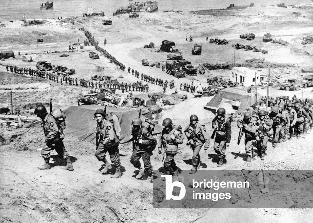 World War Two - Second World War - The D-Day invasion of Normandy. France. Endless streams of American troops move up the beaches, c.: June 1944 (b/w photo)