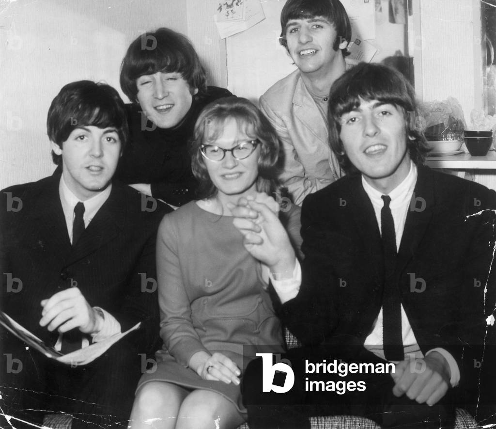 The Beatles with fan Sue Cole (17) who recently won a competition to meet her hero's, 8th January 1965.