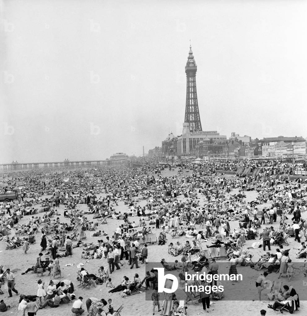 Bank holiday at Blackpool. Beach scenes/crowds/sunbathing. June 1960