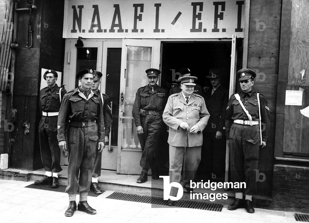 Winston Churchill Prime Minister leaves the Winston Club for British troops in the Kurfurstendamn which he opened after a parade 1945 (b/w photo)