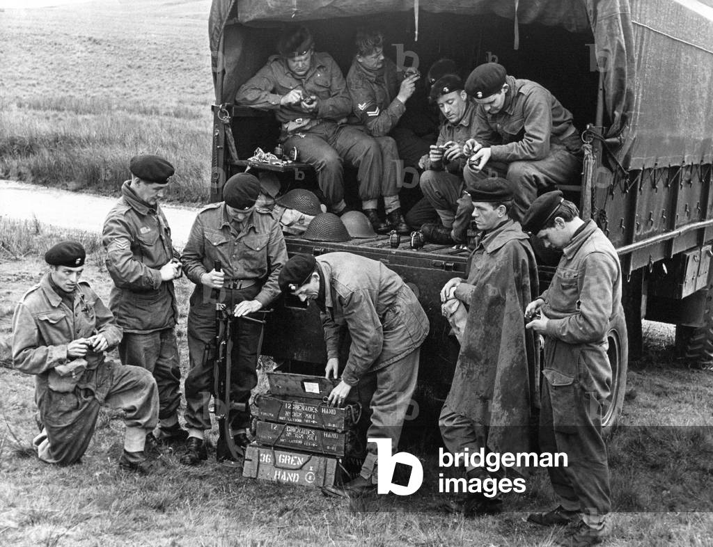 Out on the wild Welsh moors, members of X Company the Royal Northumberland Fusiliers (T.A.) unload a transport vehicle and prepare hand grenades for an exercise in open country, 22 September 1967