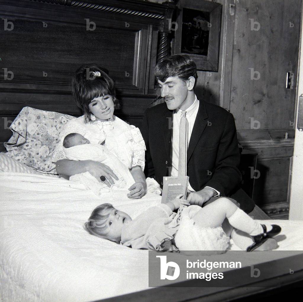 Comedian, actor and publisher Peter Cook with his wife Wendy daughter Lucy and their new born Daisy
September 1965