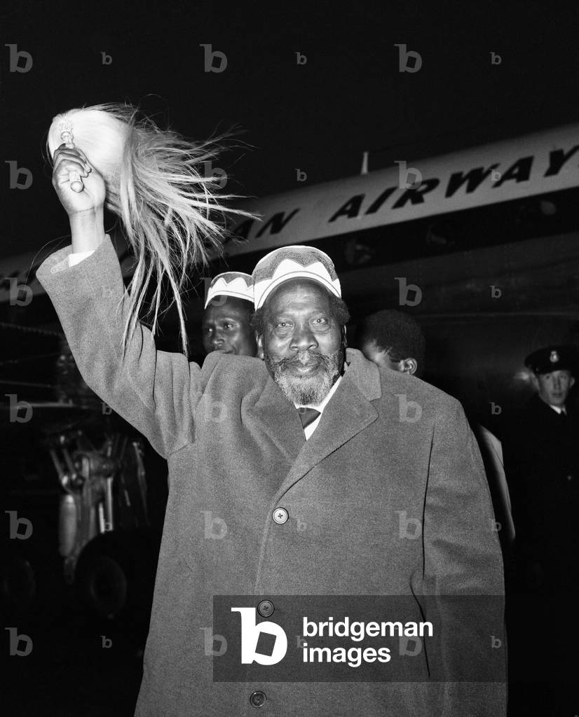 Jomo Kenyatta, leader of the Kenya African National Union, pictured on his arrival at London airport for the Kenya Constitutional Conference.
11th February 1962.