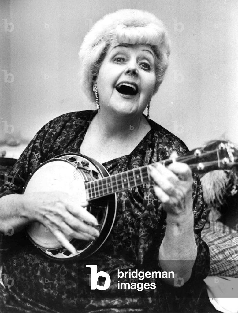 Cardiff's Tessie O'Shea, known as Two Ton tessie, pictured with her banjo at the BBC in Llandaff, Wales. 
February 1983.