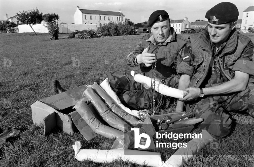 Dismantled Bomb. Members of Royal Army Ordanance Corps with Dismantled 50lb Bomb.