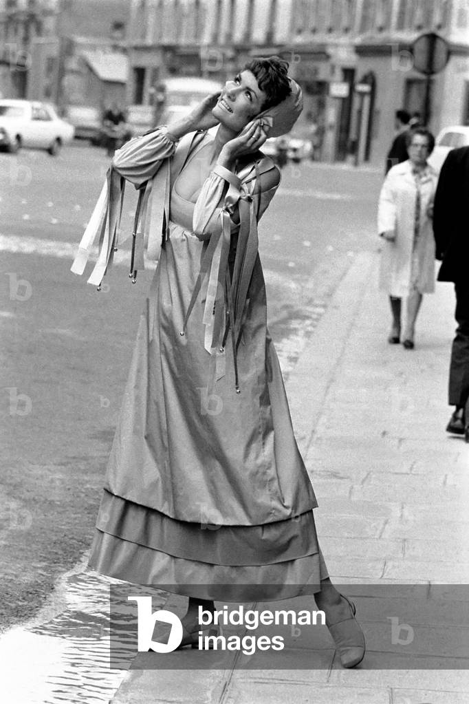 Paris fashions: Sheila Bailey, American swimming champion now modelling in Paris in multi colored Tafetta Feraud dress Empire Style. July 1970